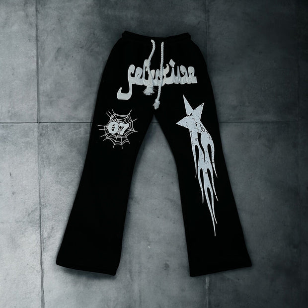 Star and letter print flared trousers