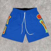 Statement bone print track shorts