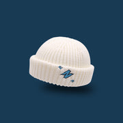 Letter embroidery woolen knit melon leather hat with flanging to keep warm