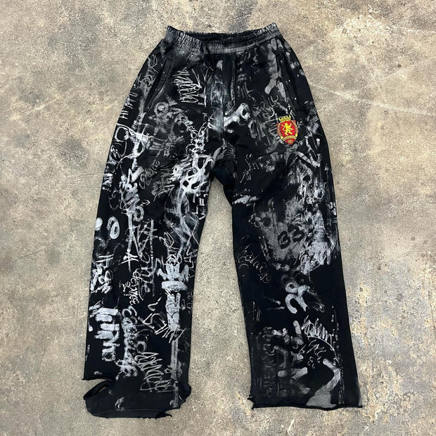 Personalized graffiti print ripped trousers
