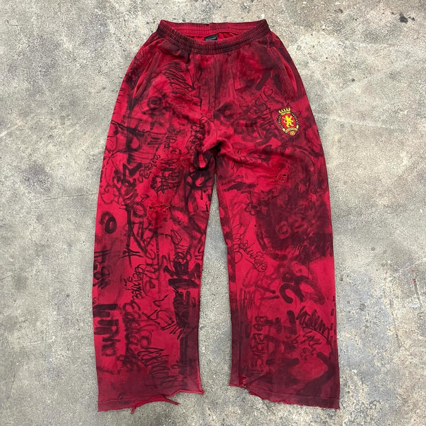 Personalized graffiti print ripped trousers